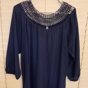Long sleeve navy blouse.